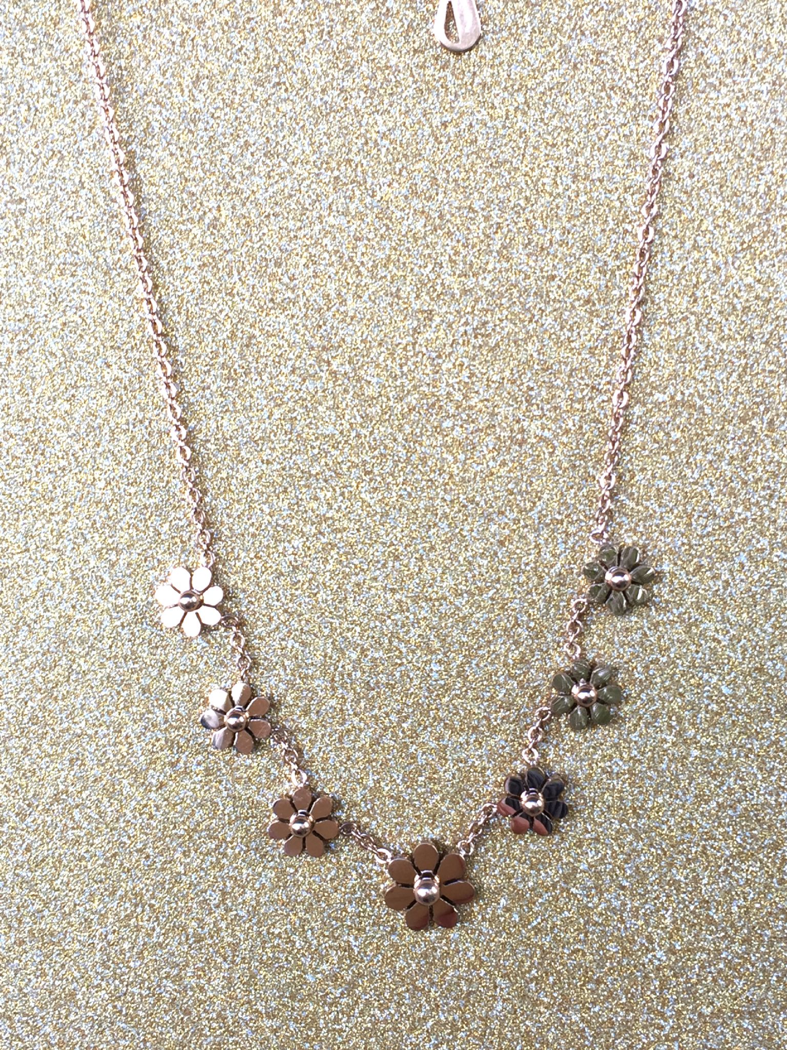 A beautiful butterfly pendant made of mother of pearl and emblazoned with small glittering crystals on a gold metal base. J020010